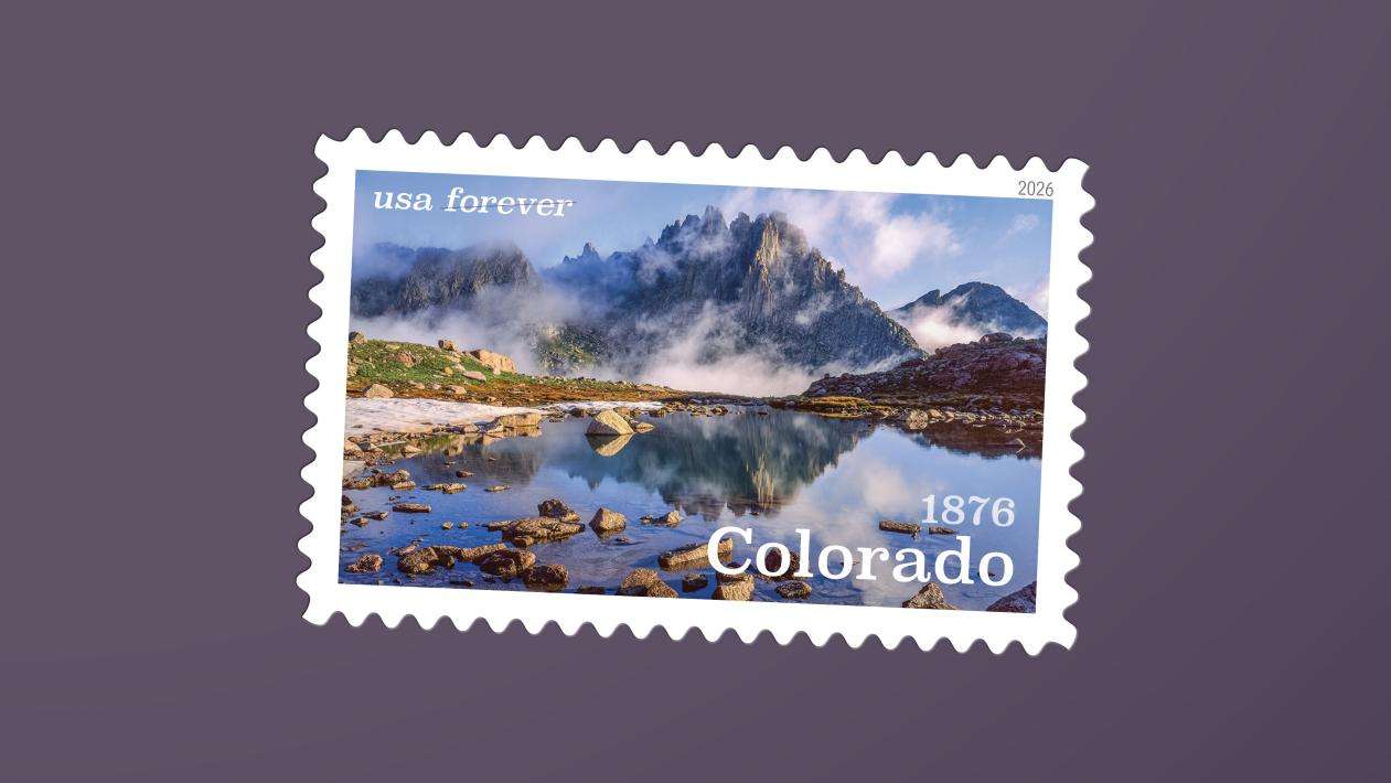 Colorado Statehood forever stamp featuring a scenic mountain lake and reflection.